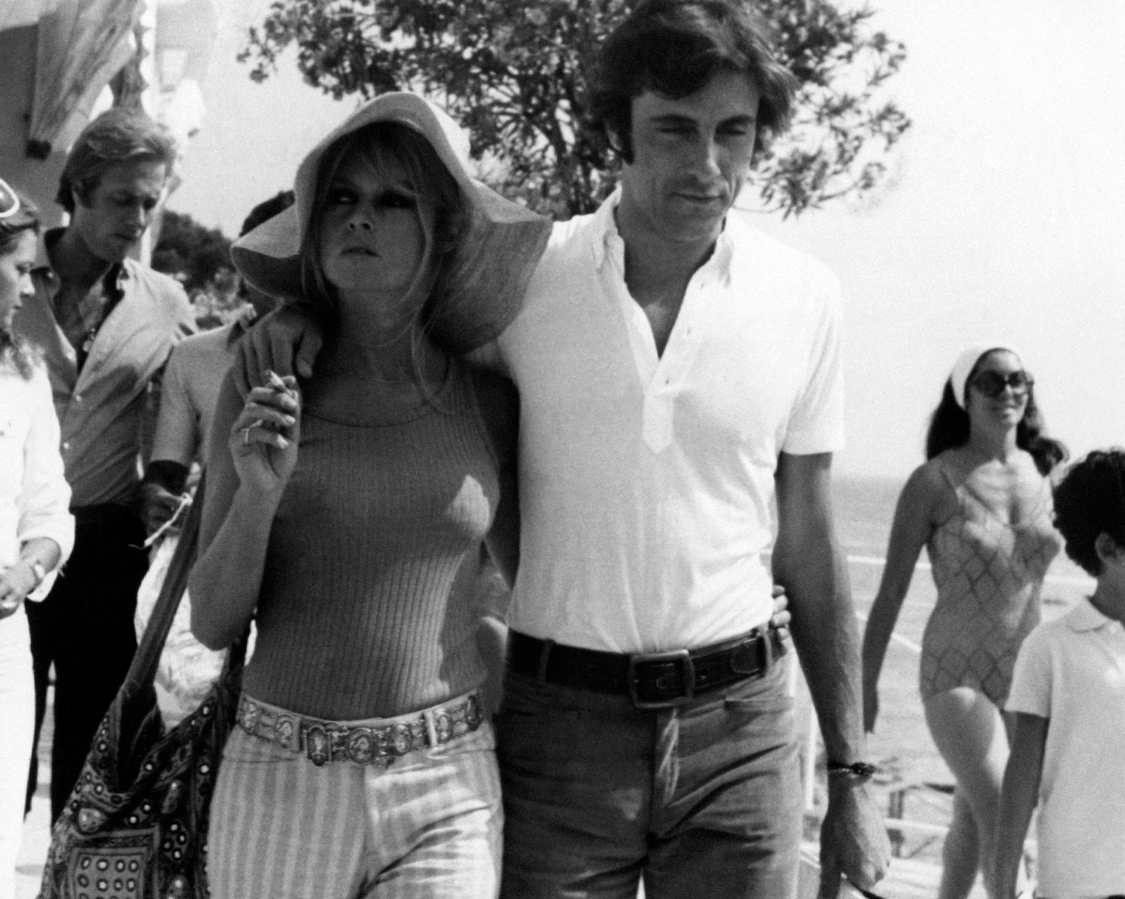 The French actress and model Brigitte Bardot walking with the Italian actor and playboy Gigi Rizzi. Saint-Tropez, August 1968