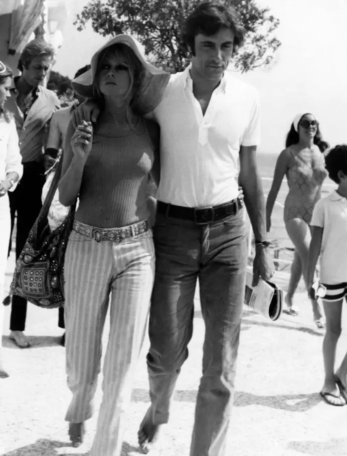 The French actress and model Brigitte Bardot walking with the Italian actor and playboy Gigi Rizzi. Saint-Tropez, August 1968