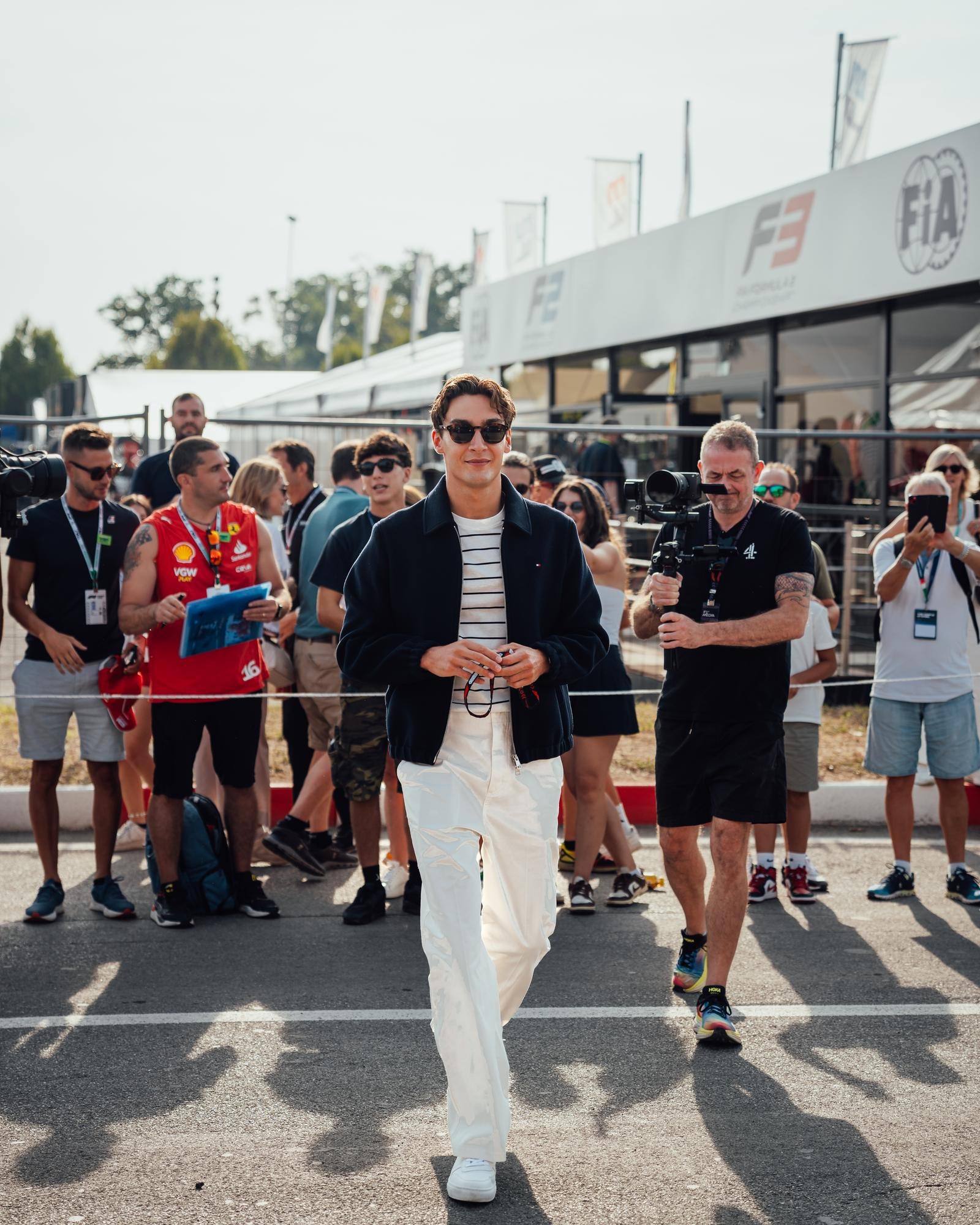The driver George Russell wearing Tommy Hilfiger  (courtesy Mercedes Amg Petronas F1 team/Tommy Hilfiger)
