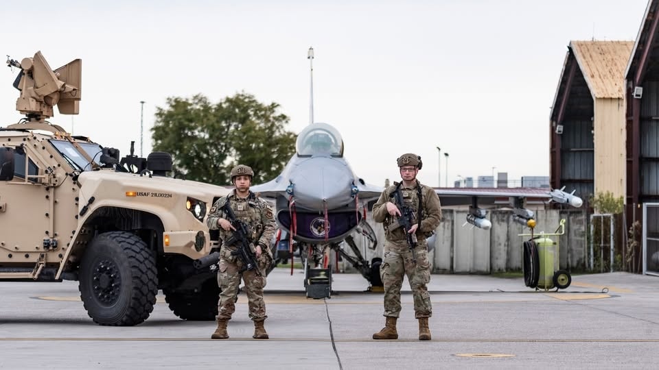 U.S. Air Force Airmen from the 31st Security Forces Squadron pose in front of a Humvee and an F-16 Fighting Falcon at Aviano Air Base, Italy, November 21, 2024. The 31st SFS maintains installation force protection and safeguards (Protection Level one, two, three and four resources) to include two F-16 fighter squadrons and provides law enforcement services to a community of almost 8,000. (Courtesy photo by Rich Cooper)