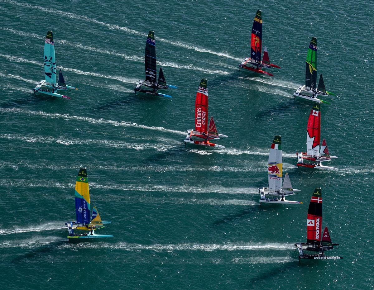 The fleet led by Switzerland SailGP Team helmed by Sebastien Schneiter ahead of ROCKWOOL Denmark SailGP Team, Canada NorthStar SailGP Team, Australia SailGP Team, Red Bull Italy SailGP Team, Spain SailGP Team, Emirates Great Britain SailGP Team, New Zealand SailGP Team, Mubadala Brazil SailGP Team and USA SailGP Team in action on Race Day 1 of The Rolex SailGP 2025 Championship ITM New Zealand Sail Grand Prix in Auckland, New Zealand. Saturday 18 January 2025. Photo: Jason Ludlow for SailGP. Handout image supplied by SailGP