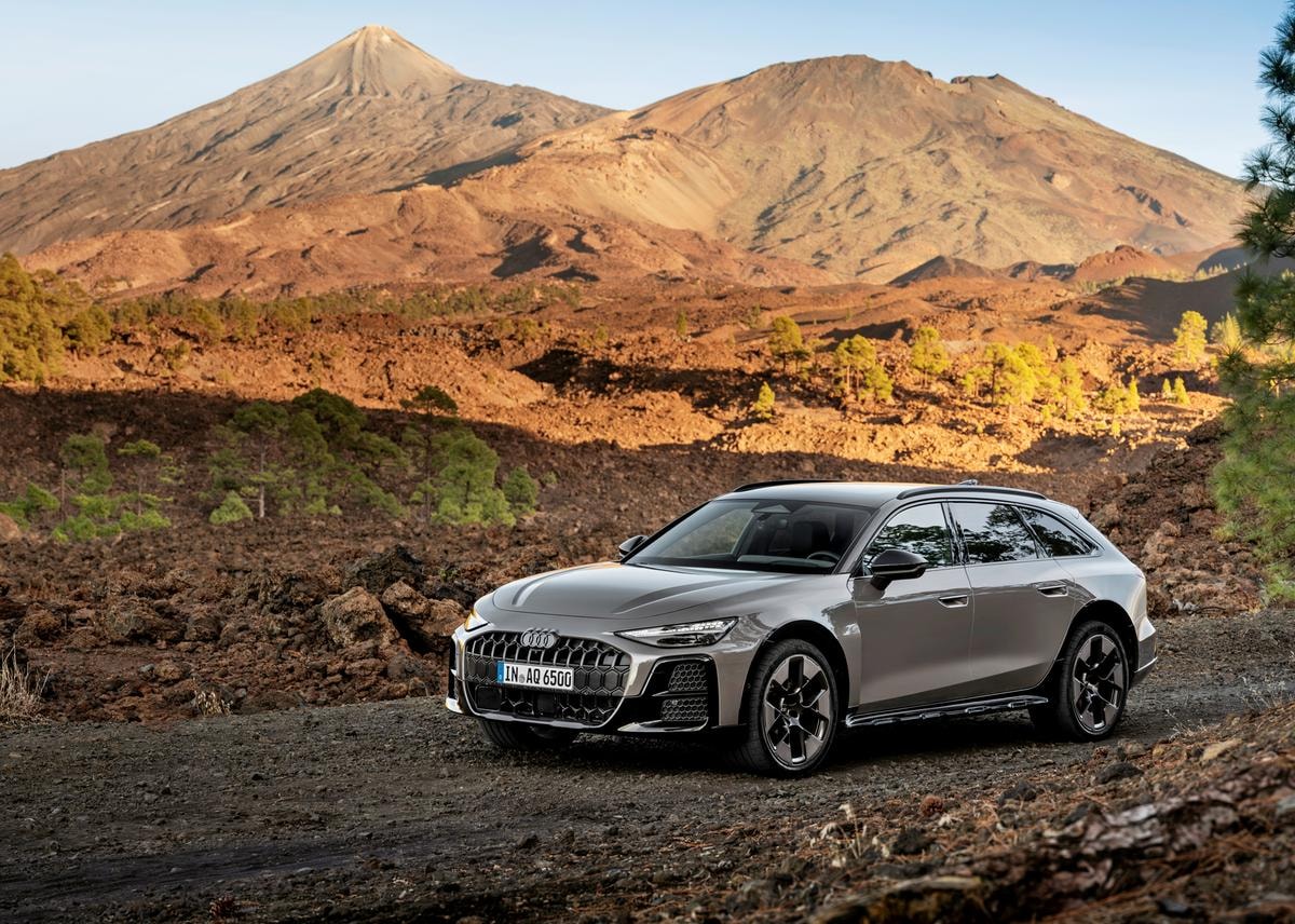 Audi A6 allroad (plateau grey metallic) in a volcanic landscape with a striking mountain panorama.